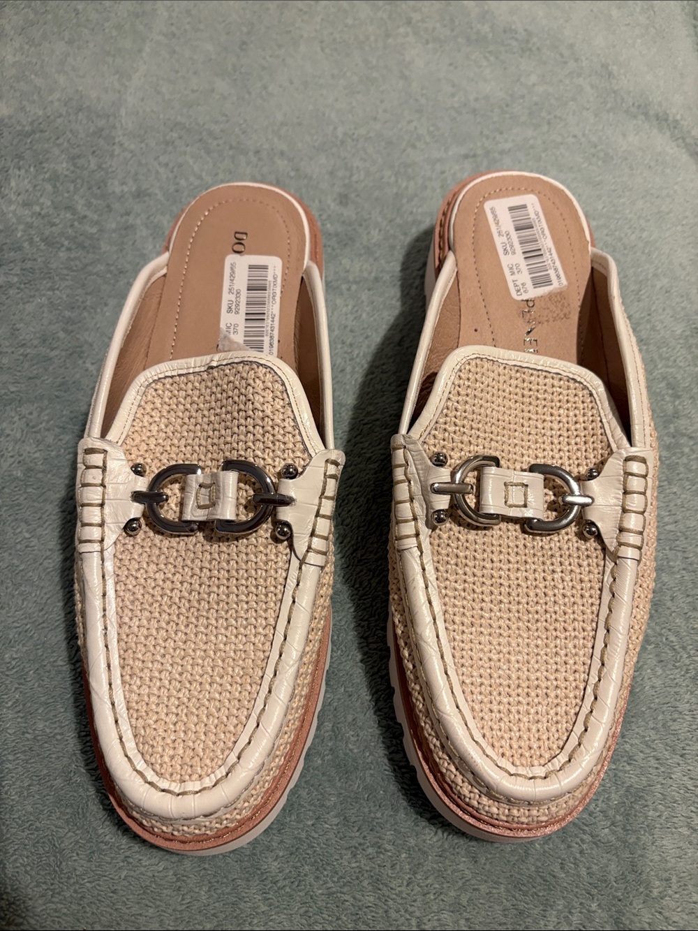 Women’s beige slip on loafers with metal bit accents